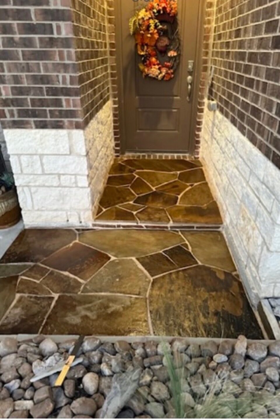 Front entry finished with a custom stone surround
